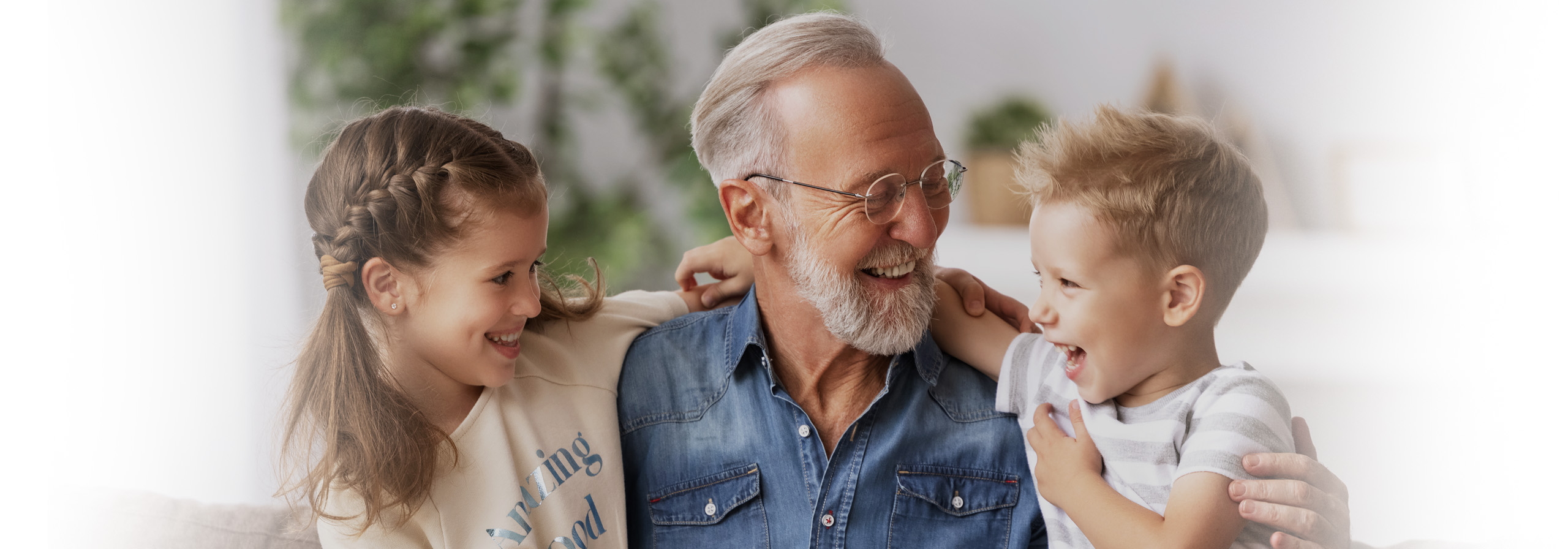 A family photo of a man with two small children