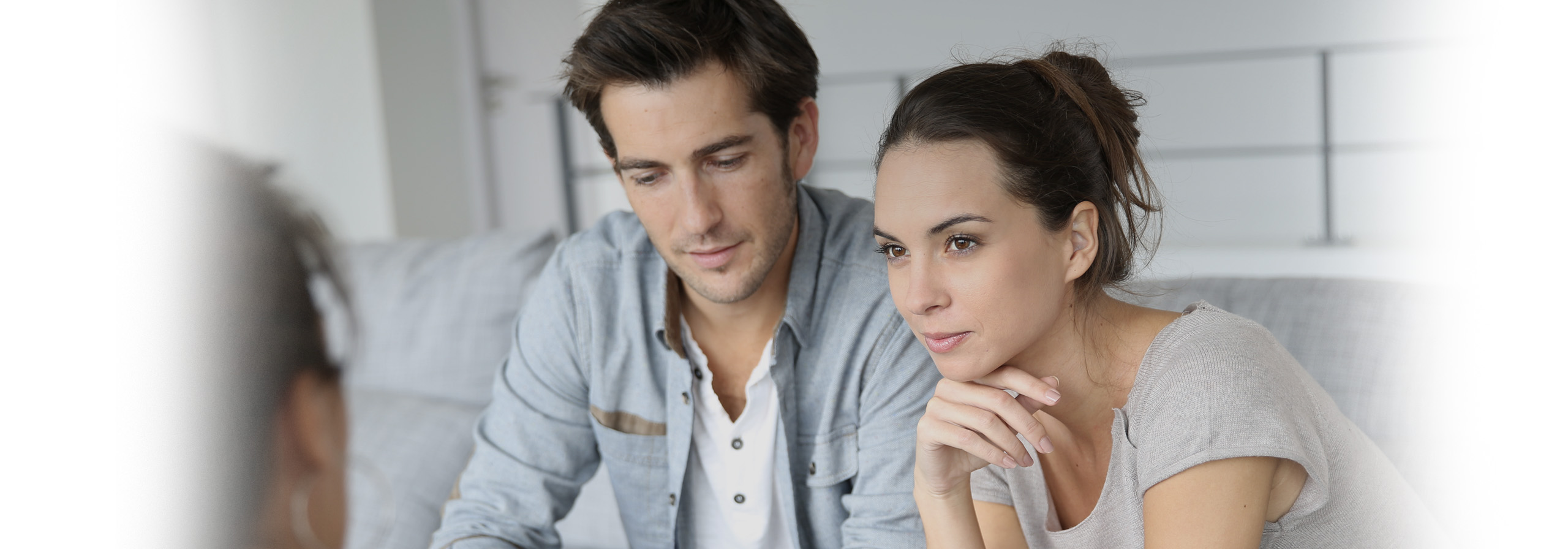 A couple discussing things with their will writer.